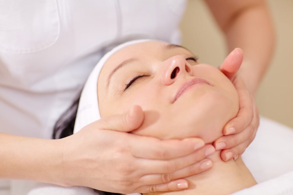 Facial massage at beauty treatment salon